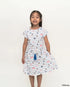 Young girl wearing a hailey dress in nautical mickey on a white background