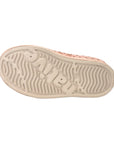 Dusty pink rubber outsole with textured grip pattern and anti-slip traction design