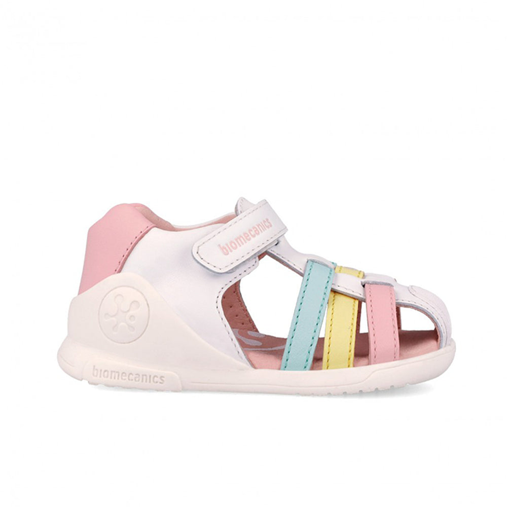 White sandal with pink, blue, and yellow accents on a white background