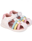White sandal with pink, blue, and yellow accents on a white background