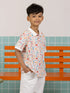 Childhood Games Polo Tee by Elly - Front view of boy in signature print.