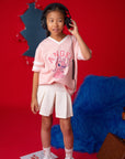 Girl wearing Stitch tee shirt and headphones