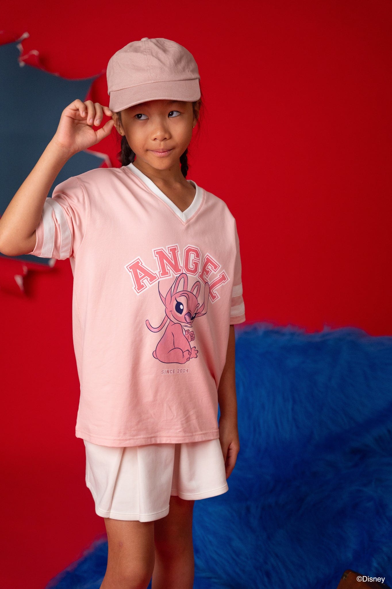 Girl in Stitch Angel tee shirt and hat