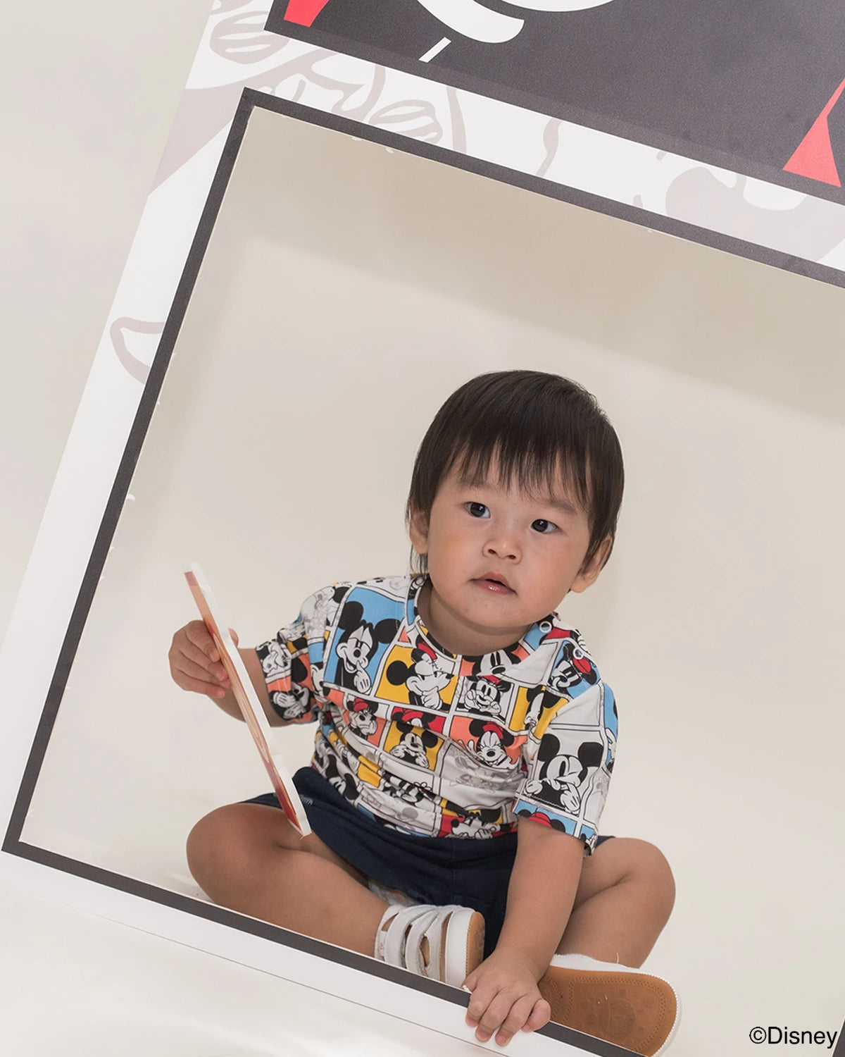 baby wearing pop comic mickey tee 