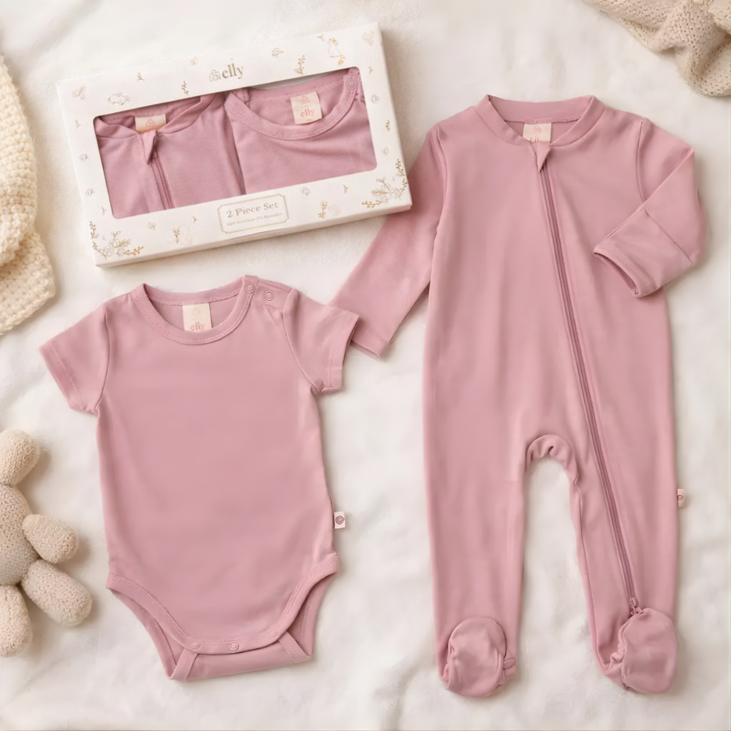 Pink baby bodysuit and onesie set on a light background
