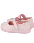 Pair of pink children's shoes with a strap on a white background