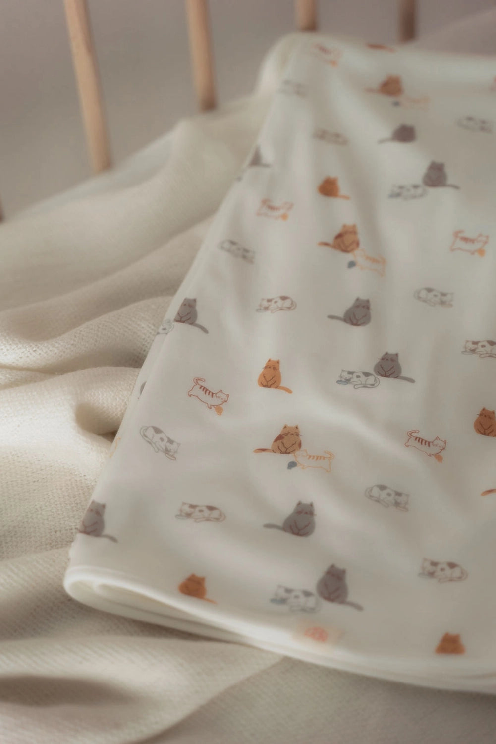 Sleepy Cats Bamboo Jersey Baby Blanket in cot