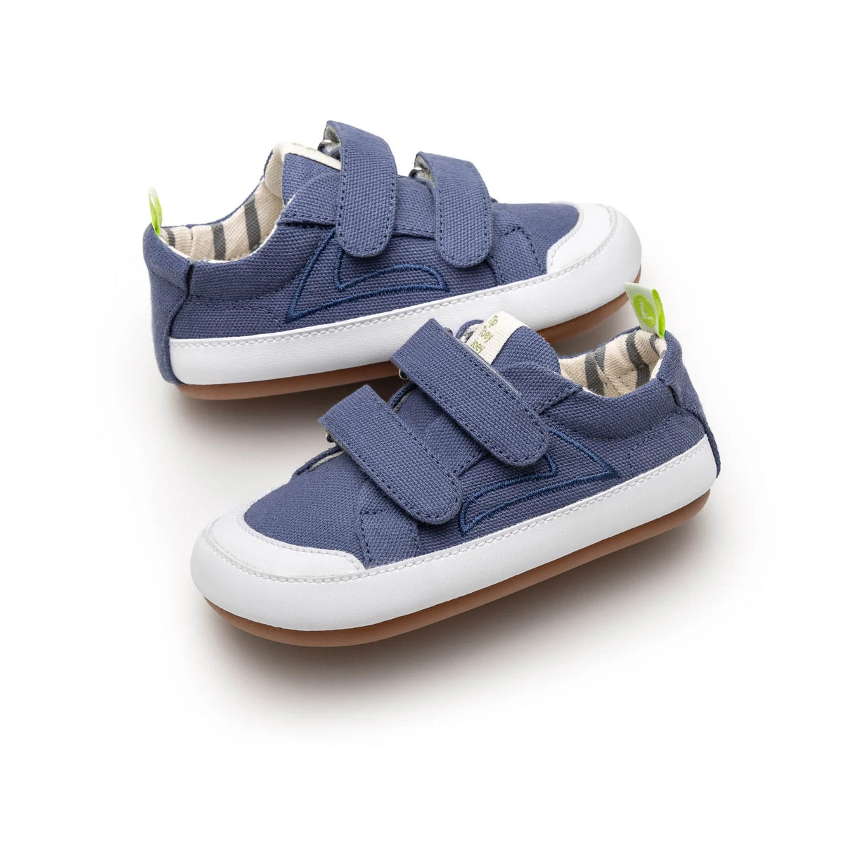 Pair of Bossy Green Sneakers in Lona Azul Klein blue canvas, angled view, baby first walker shoes