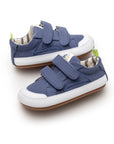Pair of Bossy Green Sneakers in Lona Azul Klein blue canvas, angled view, baby first walker shoes