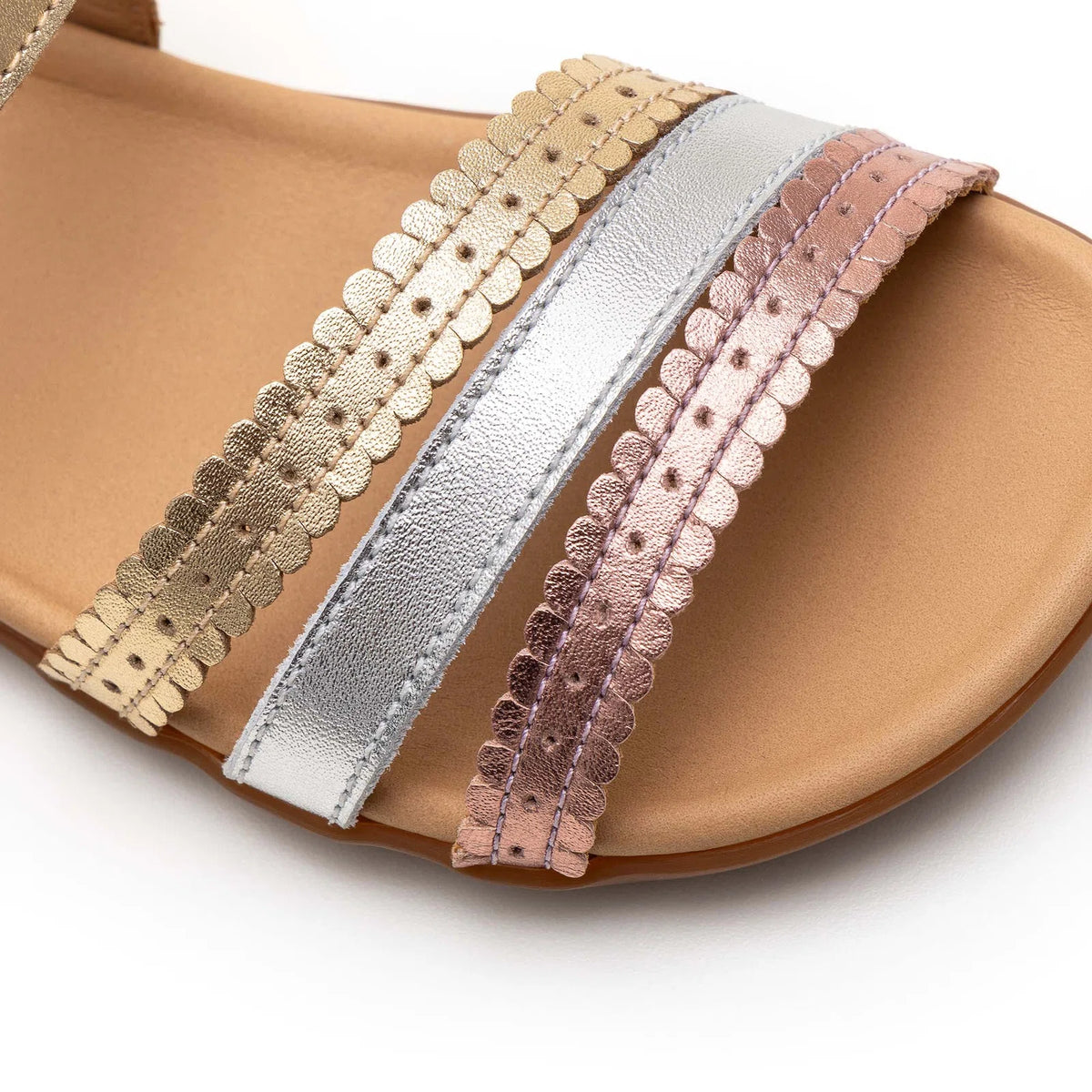 Side view of Tip Toey Joey Coil Sandals in Metal Gold / Sterling Silver / Rose Gold