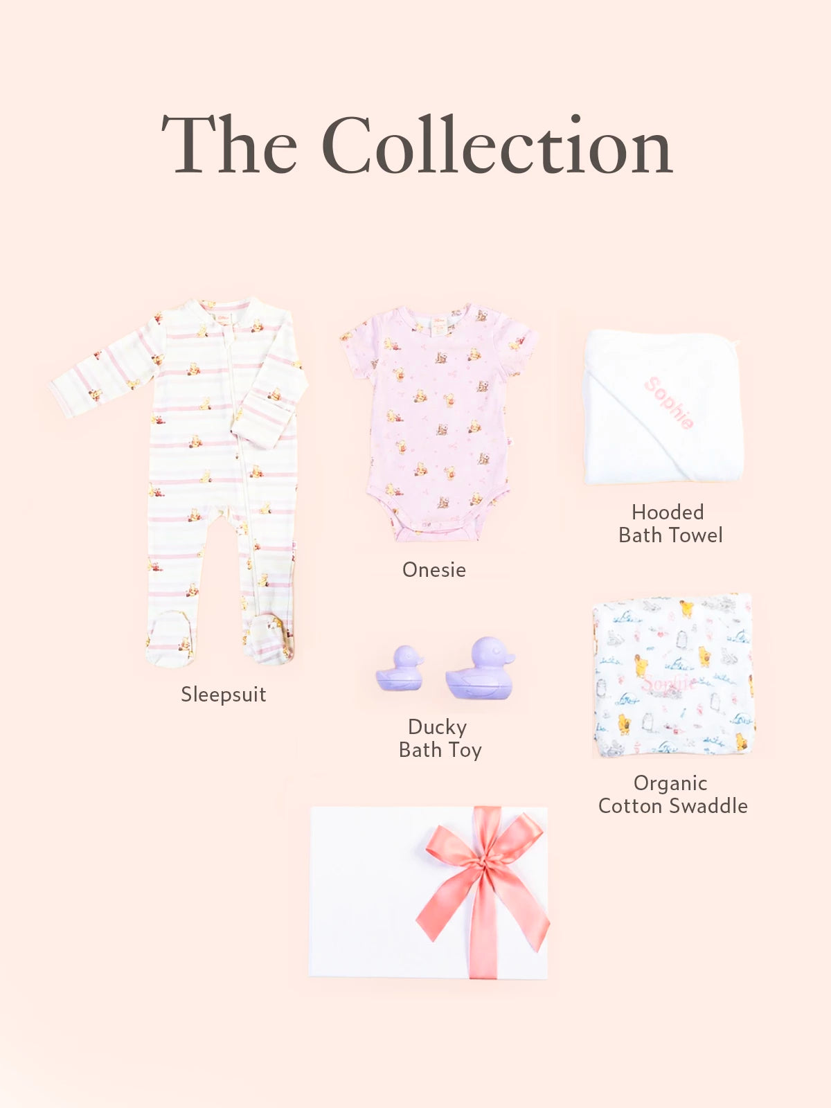 Baby product collection including a sleepsuit, onesie, hooded bath towel, ducky bath toy, and organic cotton swaddle. 