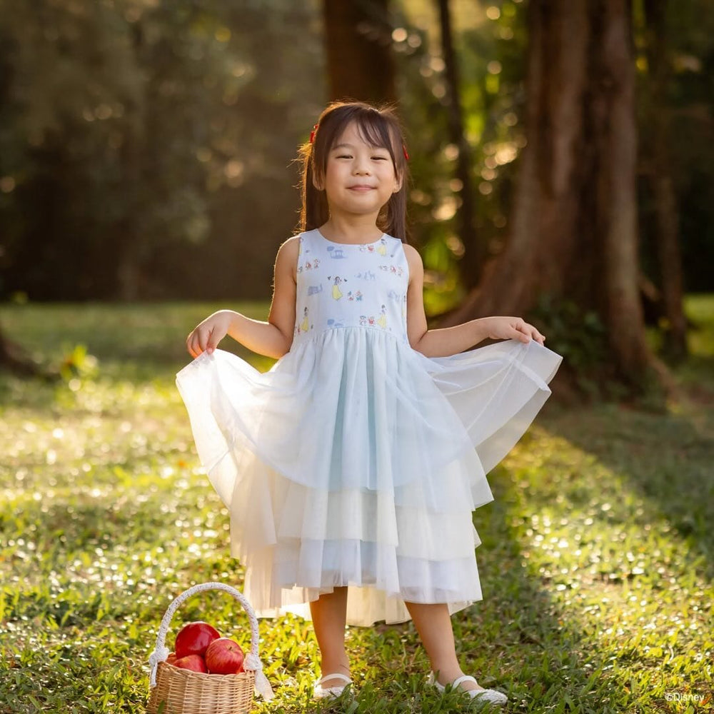 Girl in blue dress with basket