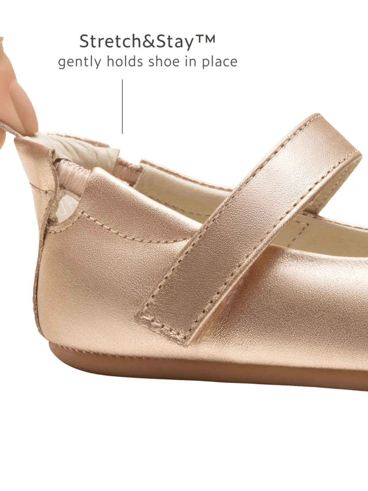Close-up of the metallic salmon leather heel with Stretch &amp; Stay elastic for a secure, easy-on fit for infants.