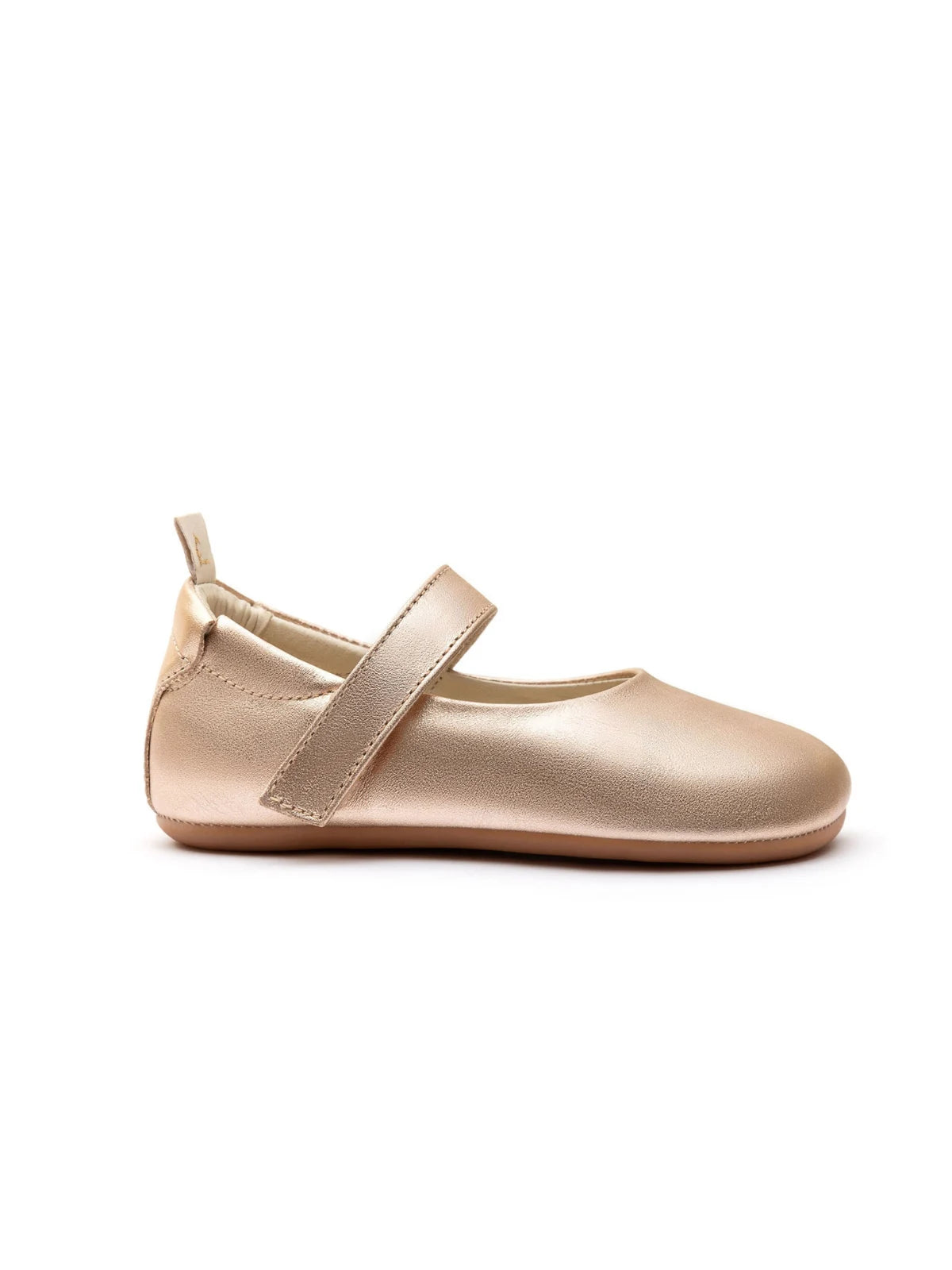 Side profile of the Dolly Mary Jane in metallic salmon, showing the slim rubber sole and ergonomic baby shoe shape.