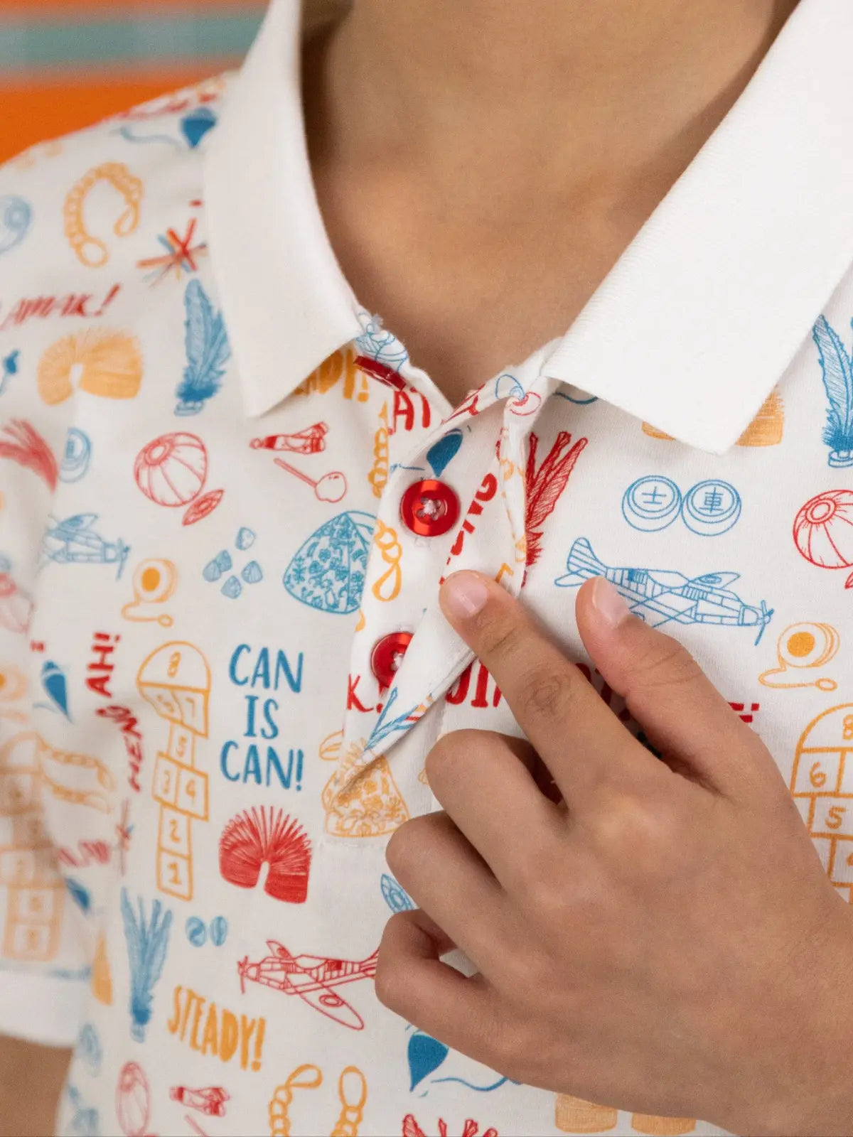 Close-up of the collar and fabric detail on the Elly Childhood Games Polo.