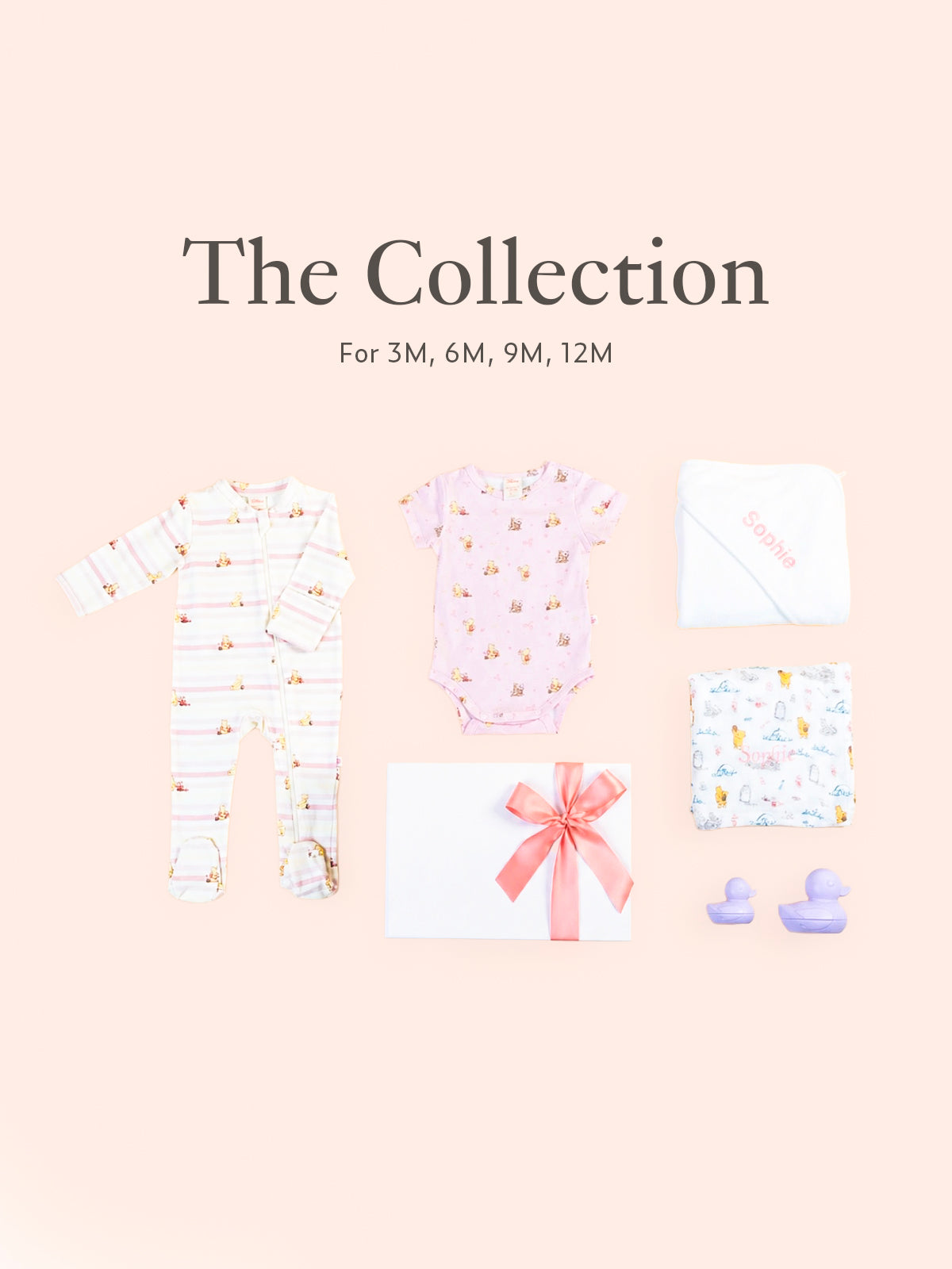 Flatlay of personalised baby gift set with baby clothing, towels and gift box