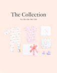 Flatlay of personalised baby gift set with baby clothing, towels and gift box