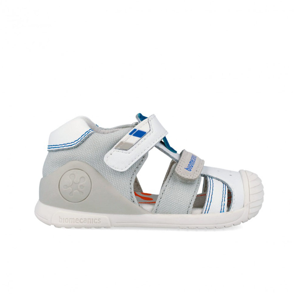 Children's sandal with gray and white design on a white background