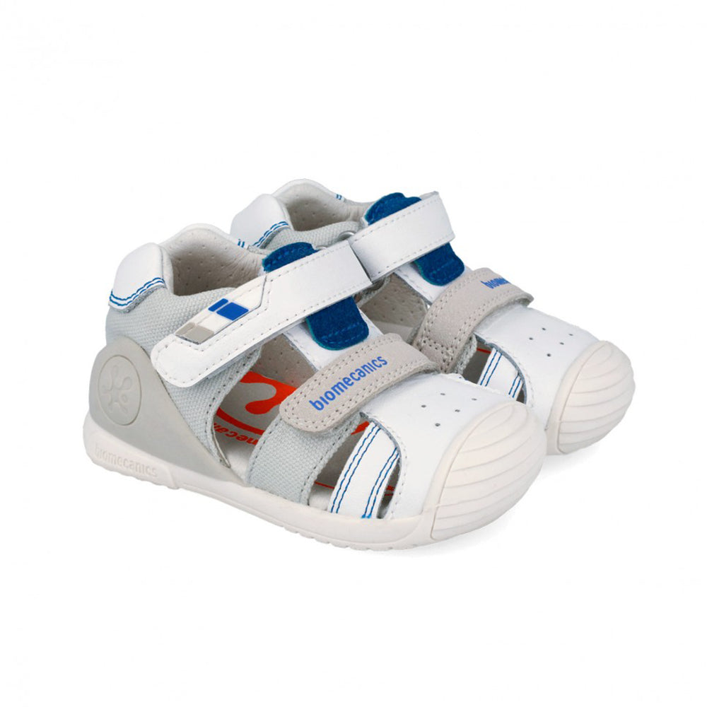 Children's sandal with gray and white and blue accent design on a white background