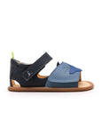 Angled view of a pair of Tip Toey Joey Flipper Sandals in Denim / Blue Tang / Navy