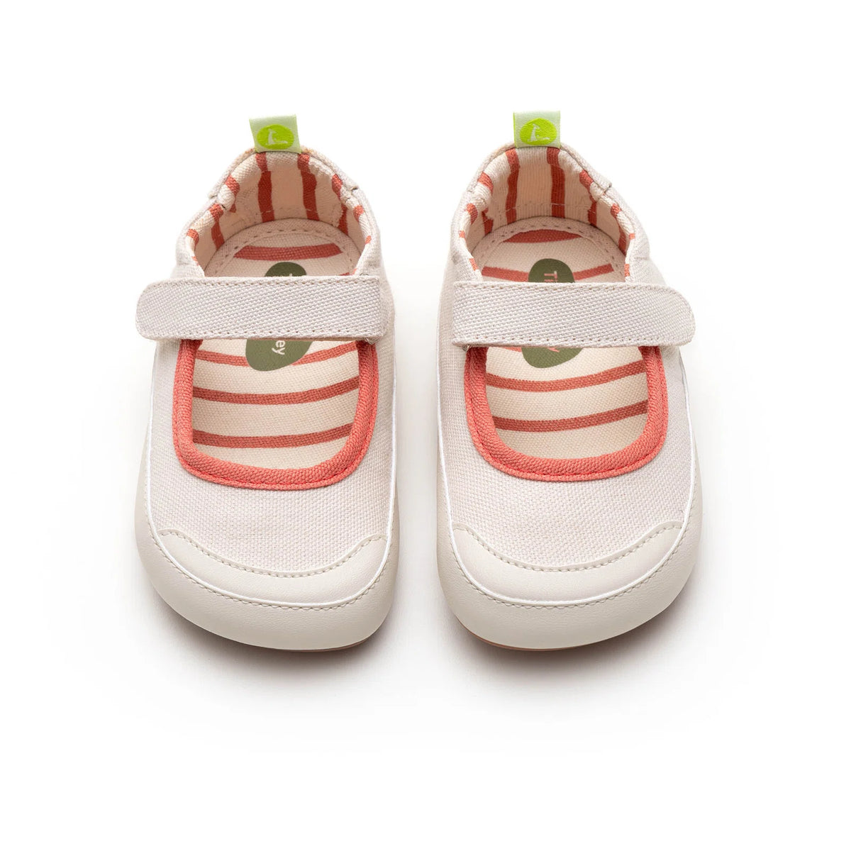 Angled view of a pair of Tip Toey Joey Gaia Green Mary Janes in Lona Creme / Lona Salmao