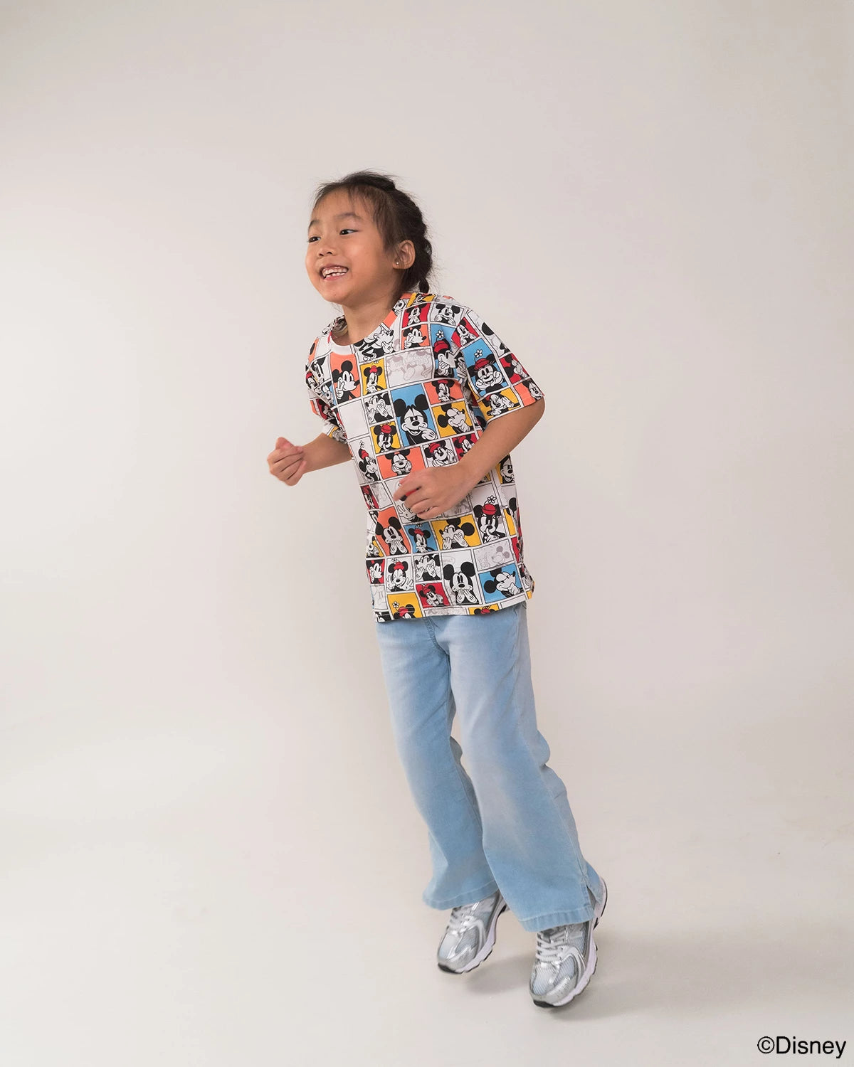 Child wearing pop comic mickey on a white background