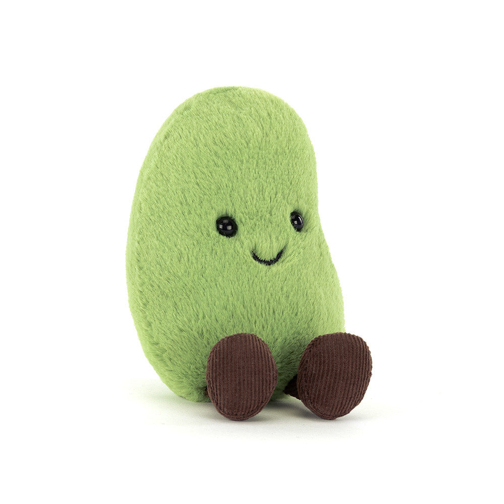 Green bean plush toy with a smiling face on a white background