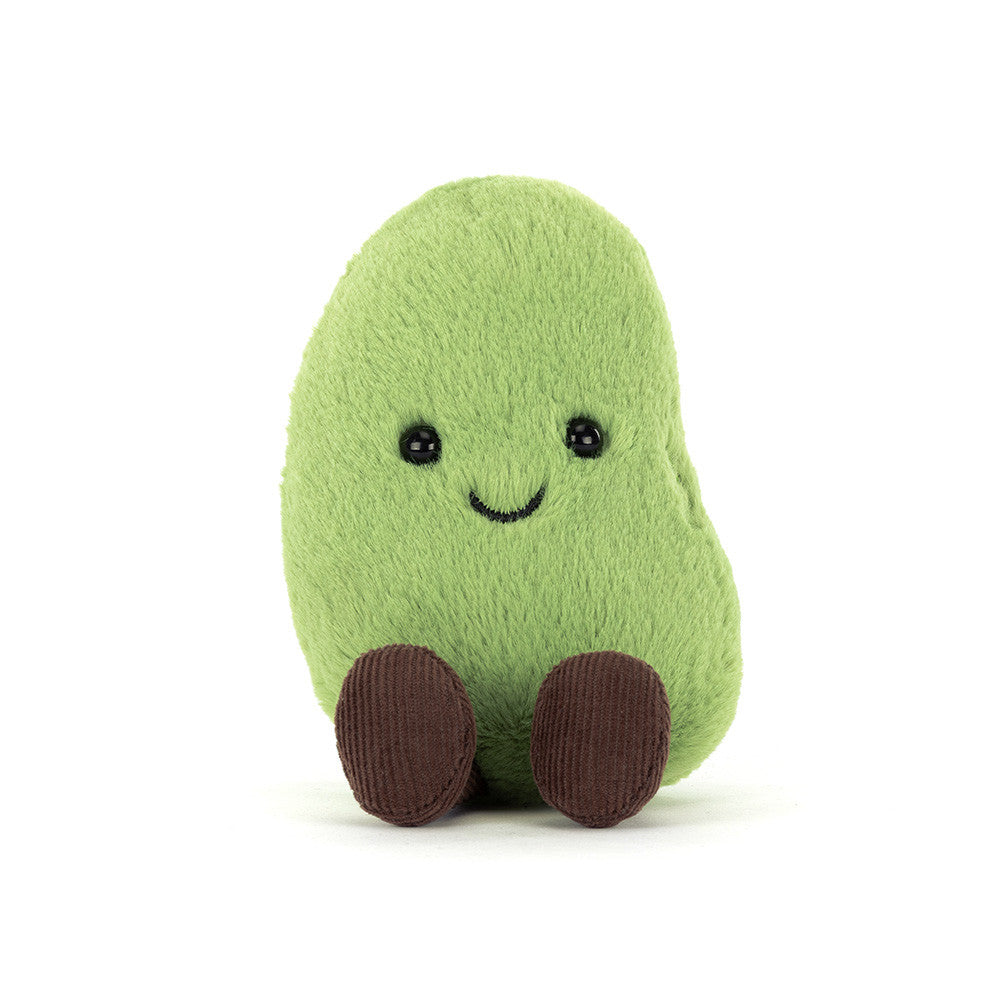 Green bean plush toy with a smiling face on a white background