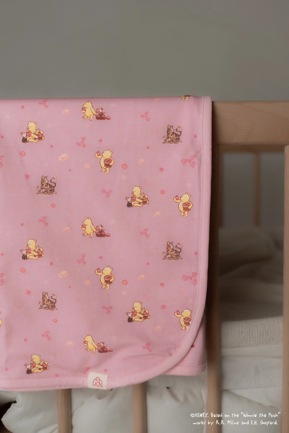 Jersey Blanket - Pink Harvest Pooh folded over cot