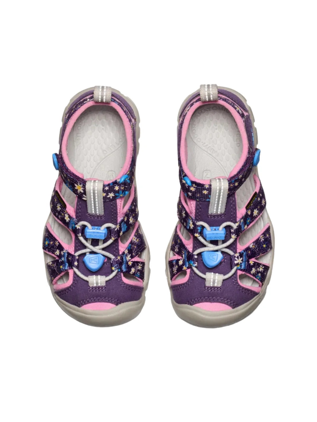 Two Daisies Marina patterned KEEN sandals displayed together, showing the consistent floral motif and durable pink accents.