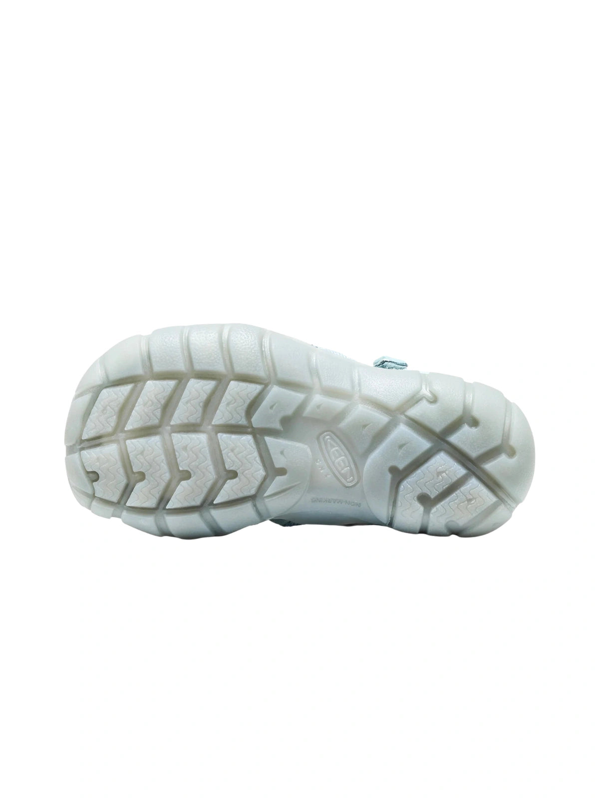 The bottom of the Ice Blue KEEN shoe, displaying the grey non-marking rubber sole with a multi-directional lug pattern for traction.