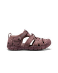 Side view of a mauve-colored KEEN brand waterproof sports sandal for children, featuring a durable rubber toe bumper, adjustable bungee laces, and a secure heel strap.
