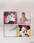 Child wearing pop comic mickey tee and holding up four framed Disney character posters on a white wall.
