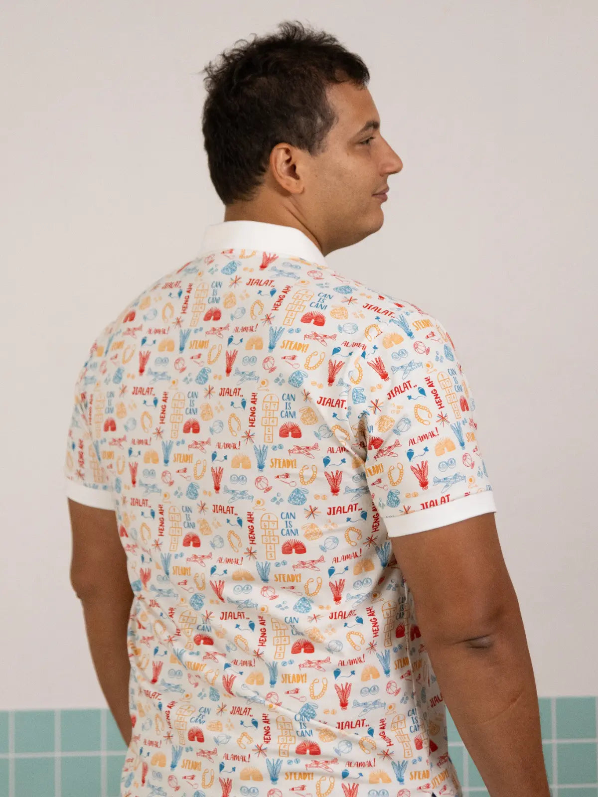 Back view of the Elly Men's Polo in Childhood Games print.