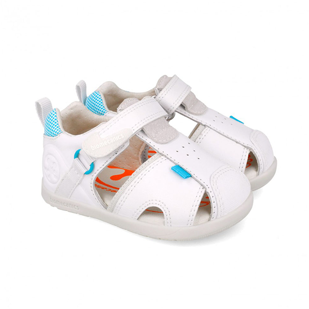 White sandal with blue accents on a white background