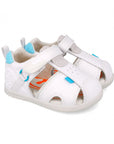 White sandal with blue accents on a white background