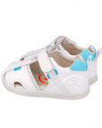 White sandal with blue accents on a white background