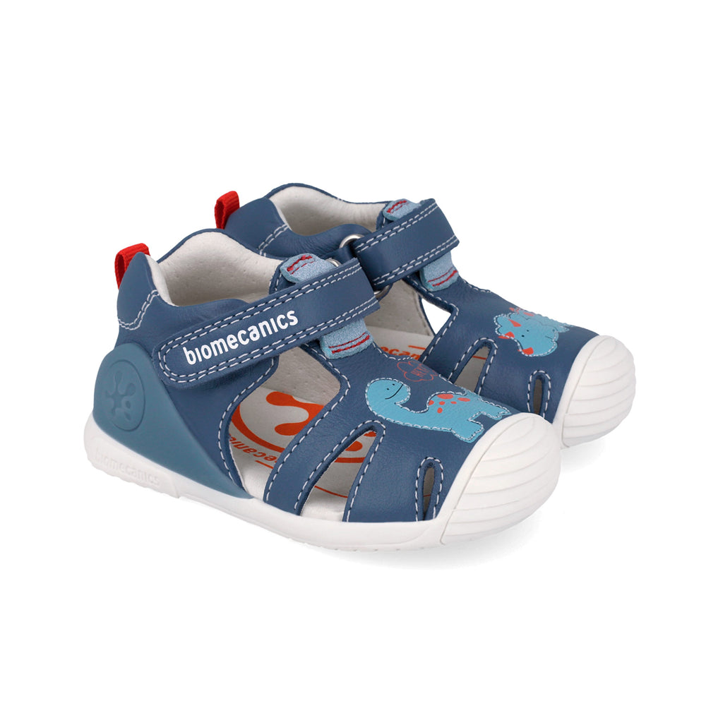 pair of Navy children's shoe with dino design and velcro straps