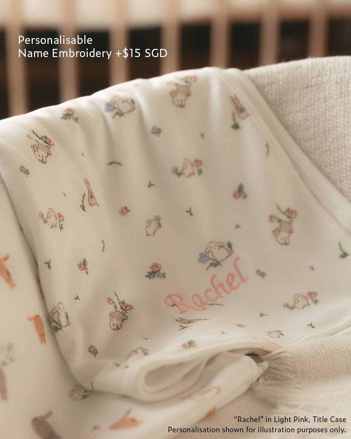 personalisable name embroidery with "Rachel" in light pink thread title case on jersey blanket