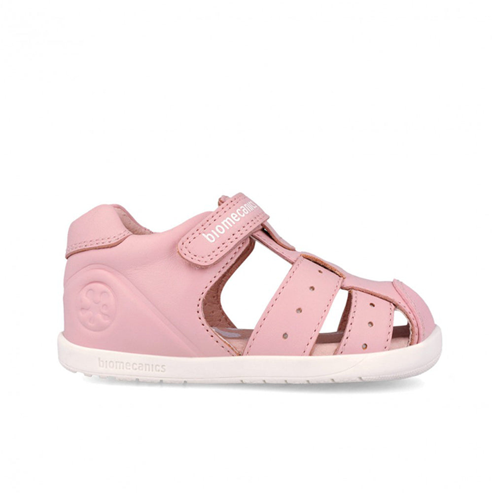 Pink sandal with a white sole on a white background