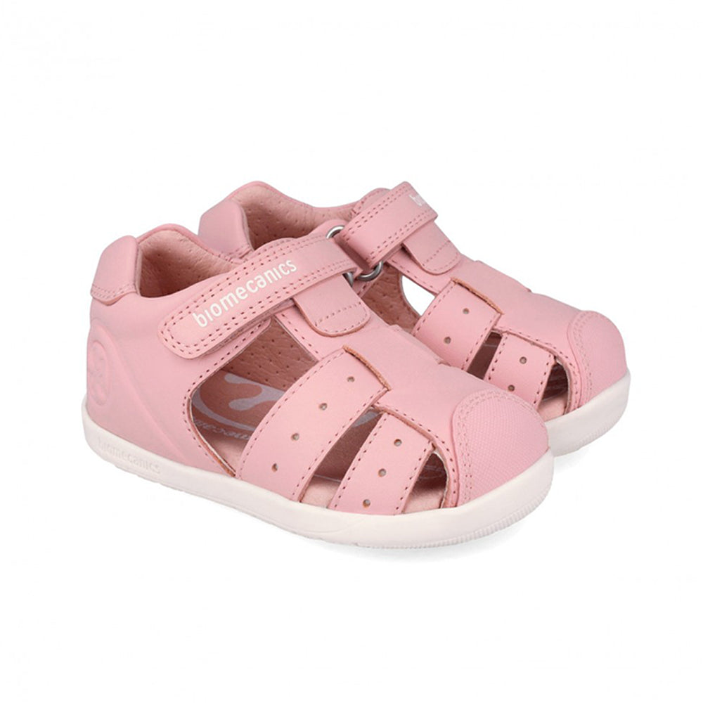 Pink sandal with a white sole on a white background