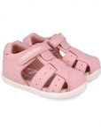 Pink sandal with a white sole on a white background