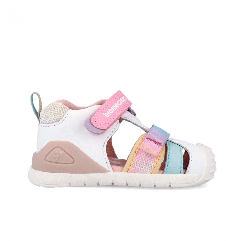 Children's sandal with colorful straps on a white background