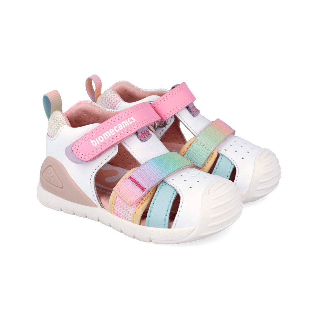 Pair of children's sandals with colorful straps on a white background