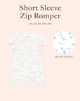 Short sleeve zip romper with blue sea creature pattern on a light pink background