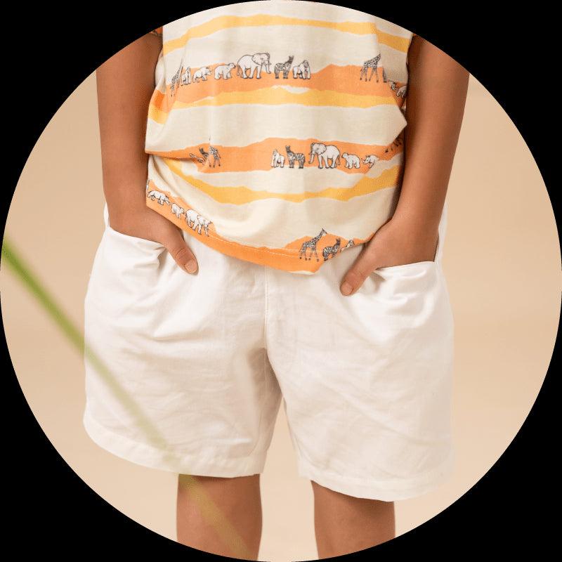 White shorts with safari-themed shirt