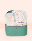 Baby gift set with onesie and pillow in a turquoise box