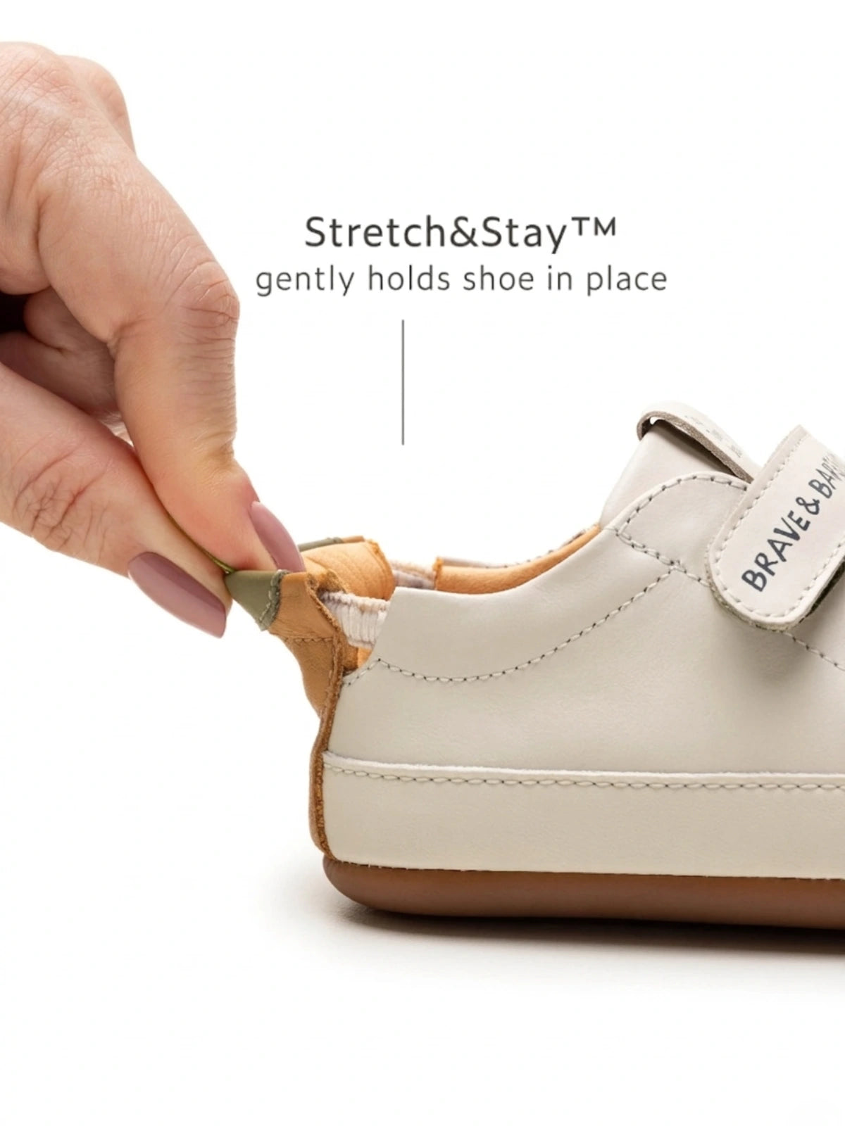 Close-up of the Stretch&Stay elasticated heel on a Tapioca leather sneaker being pulled to show secure fit.