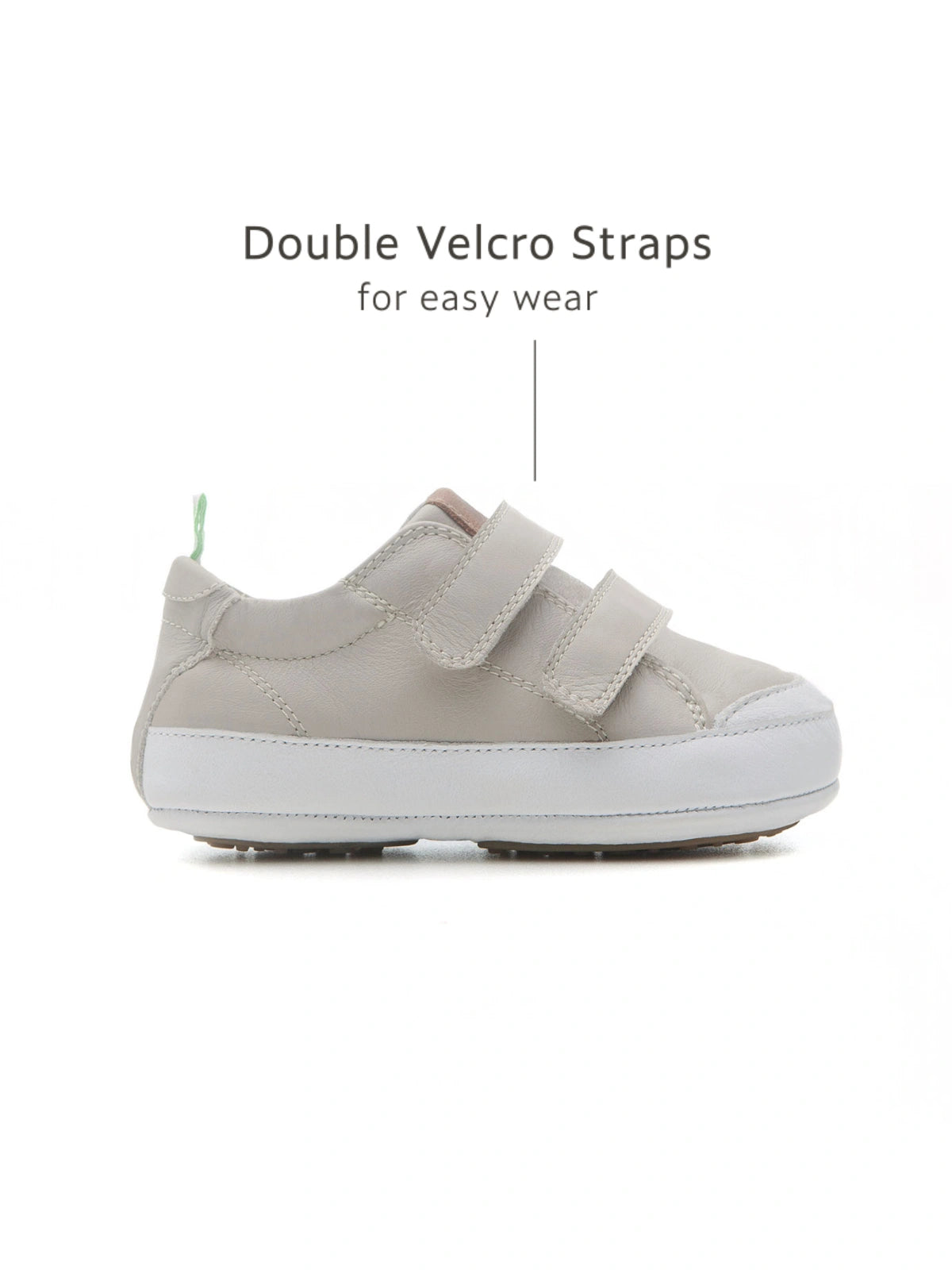 Side view of the Pumice Bossy sneaker highlighting the double velcro straps for an adjustable, secure fit.