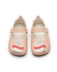 A pair of pink baby shoes seen from above, highlighting the cupcake design on the toes and the wide, foot-shaped toe box.